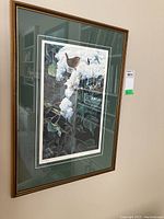 Full view of framed print with visible number and signature under glass