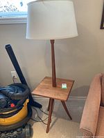 Full view of lamp with side table and shade