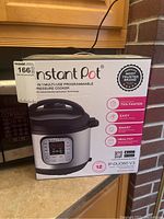 Front view of Instant Pot box showcasing model IP-DU060 V3 features and branding