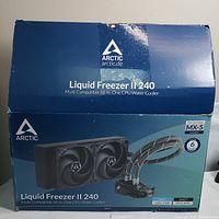 Box front showing product name ARCTIC Liquid Freezer II 240, image of cooler with dual fans and radiator, compatibility info.