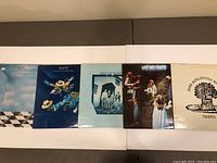 Photo showing front covers of 5 Traffic vinyl records in a row with colorful classic rock artwork.