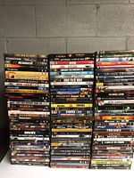 The entire DVD collection arranged in stacks showing the front spines and titles