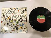 Front cover of Led Zeppelin III vinyl record with colorful artwork and text design