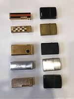 Front view of 10 lighters arranged in two columns, showcasing different metal finishes and designs including Zippo and butane types