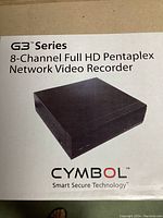 Front view of the sealed box with product image and detailed branding showing 'G3 Series 8-Channel Full HD Pentaplex Network Video Recorder' with CYMBOL logo and tagline 'Smart Secure Technology'.