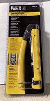 Front view of the Klein Tools Compression Crimper sealed in retail packaging showing the tool and branding.