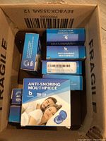 Box containing 8 Breolife Anti-Snoring Mouthpiece packages.