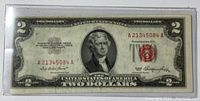 Front side of circulated USA 2 dollar bill with serial number A21345084A in protective sleeve, showing Thomas Jefferson portrait and red seal.