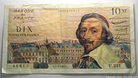 Front side of 1962 France 10 Nouveaux Francs banknote showing portrait and building.