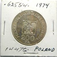 Front side of the 1974 Polish 200 Zloty silver coin showing Polish eagle and denomination.
