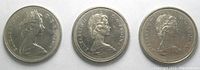 Obverse side of three Canadian 1 dollar coins showing Queen Elizabeth II portrait, dated 1969, 1975, and 1975.