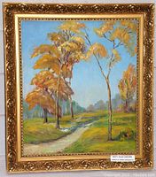 Frontal photo showing the overall painting with autumn trees and a winding path, framed in an ornate gold frame.