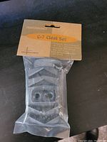 Photo showing the C-7 Cleat Set in unopened packaging with label and compatibility information.