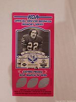 Photo of the KOA official Denver Broncos Memory Series card featuring Fran Lynch with promotional scratch-off sections.