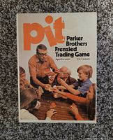 Original game box of Pit, Parker Brothers Frenzied Trading Game from 1973, showing front cover with players shown trading cards.