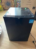 Front view of the Koolatron black bar fridge showing the ENERGY STAR label and overall condition