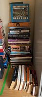 Stack of assorted books including history and civil war titles in mixed hardcover and softcover editions