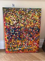 Full view of the abstract acrylic painting on canvas showing vibrant circular patterns and colors.
