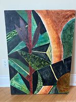 Full view of the abstract acrylic painting showing organic and geometric shapes in green, brown, black, and red tones.