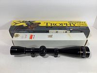 Bushnell Trophy Brush and Bushnell Banner boxes with Trophy Brush scope in front