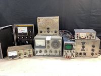 All seven test instruments displayed together on bench