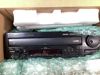 Top view of Pioneer CLD-3090 laser disc player packed in original box with protective foam and bubble wrap.