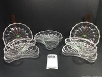 Full view of all eight crescent-shaped mezze plates arranged in groups.