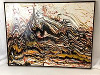 Full view of framed abstract painting featuring marbled acrylic swirls in black, white, yellow, orange and red