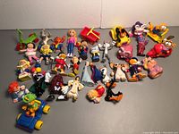 All figurines arranged on a surface showing the variety and quantity