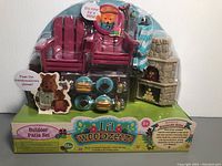 Front view of unopened Lil Woodzeez Outdoor Patio Set with all items visible in packaging.