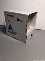 Side view of the packaging box showing the candle size, burn time, and scent details.