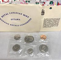 1972 Royal Canadian Mint sealed coin set in plastic with titled envelope showing wear and information card.