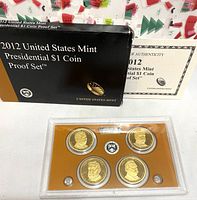 Photo shows the 2012 United States Mint Presidential $1 Coin Proof Set in original black and gold box with Certificate of Authenticity visible in background.