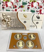 Photo of the boxed 2015 US Mint Presidential $1 Coin Proof Set with four coins inside plastic casing.