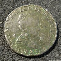 Obverse side of the 1837 Spanish 4 Maravedis coin showing a bust in profile with inscriptions around the edge.