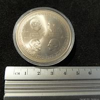 Obverse side of the commemorative medal showing four Canadian Governors General portraits from 1952 to 1977 along the rim and dates with names in the center.