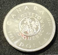 Reverse side showing Canadian floral emblem and city names with denomination and dates.