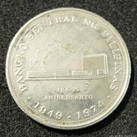 Front side of the 1974 Philippine 25 Piso silver coin showing Bangko Sentral ng Pilipinas building and 25th Anniversary inscription.