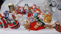 Full collection of assorted Christmas ornaments on white background showing variety in materials and styles.