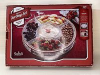 Photo of the original packaging box showing the product image, brand, and set details.