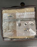 Photo of packaged furniture slipcover with label showing product details