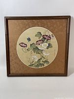 Full view of the framed silk screen floral artwork featuring morning glories, daisies, and a butterfly.