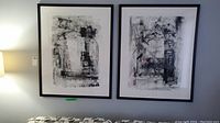 Two framed abstract artworks hung side by side on a wall
