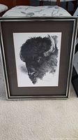 Full view of framed bison wall art showing frame and the detailed bison head artwork.