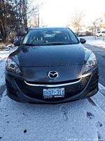 Front exterior view showing grille, headlights, paint and Ontario license plate.