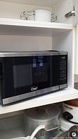 Front view of Mastercraft Chef microwave oven showing door, digital display, and control panel.