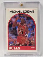 Front image of Michael Jordan 1990-91 Hoops basketball card in protective case showing clear image and details on the card.