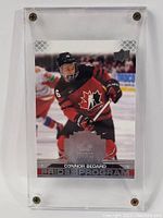 Front view of Connor Bedard rookie hockey card encased in screw-down case