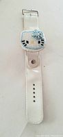 Full view of the white leather strap watch with closed seed bead Hello Kitty cover.