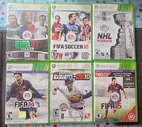 Front view of six Xbox 360 sports game cases showing titles and cover art for FIFA 07, FIFA 10, NHL Legacy Edition, FIFA 14, MLB 2K10, and FIFA 15 Ultimate Edition.